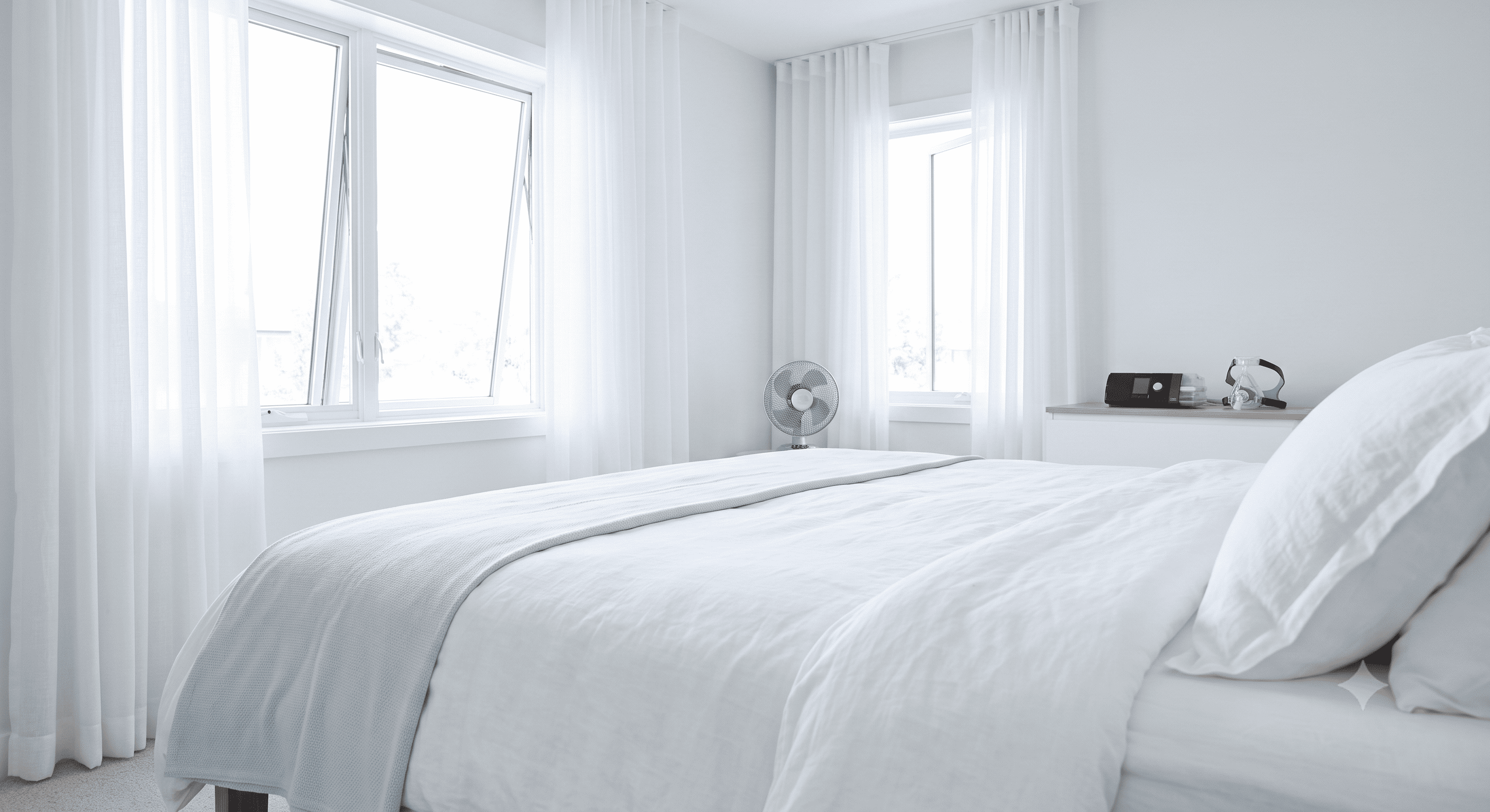 Wide-angle view of a cool, clean, bright summer bedroom with fresh linens, a window ajar, and a CPAP machine neatly arranged.